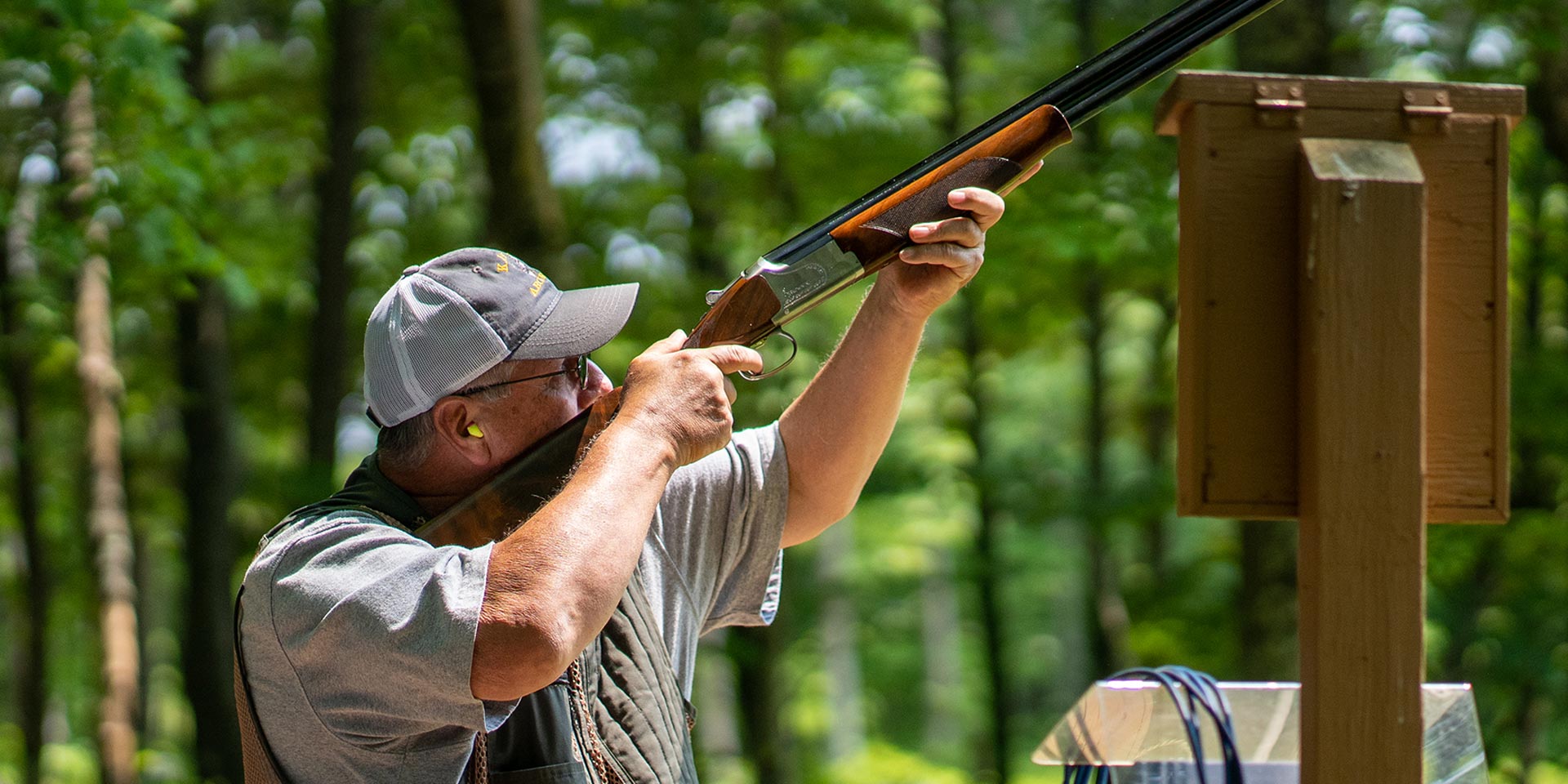 man shooting gun