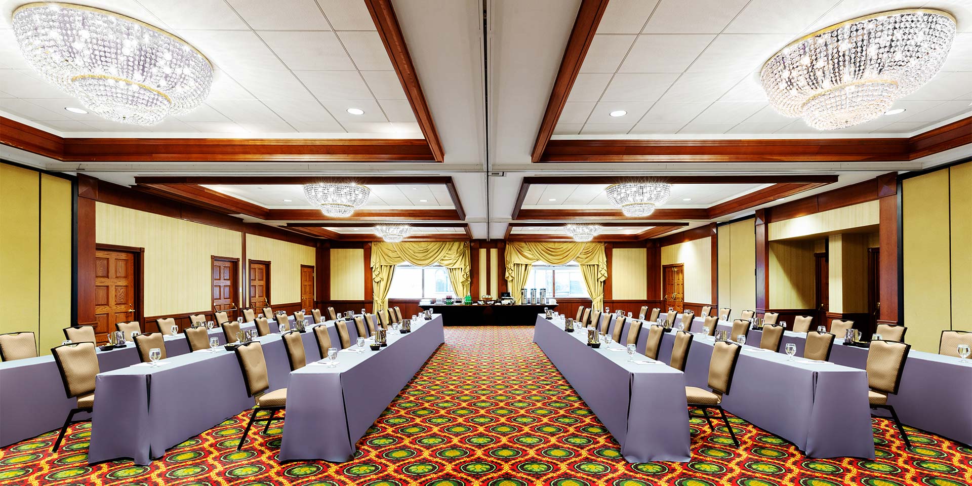 large conference style room with tables facing each other