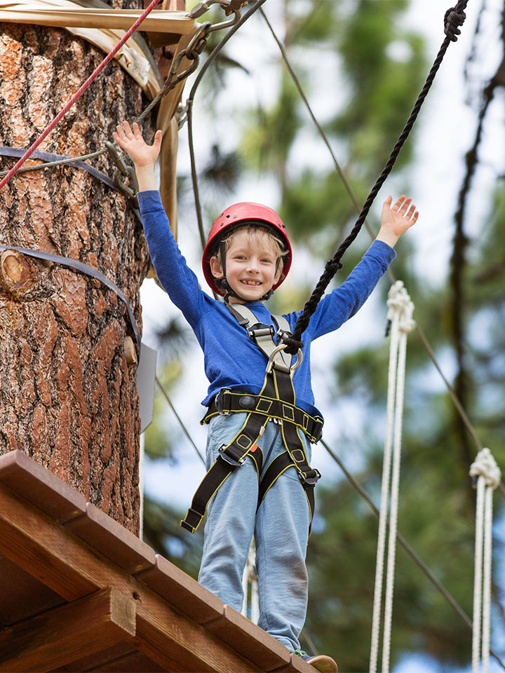 young boy on ropes course