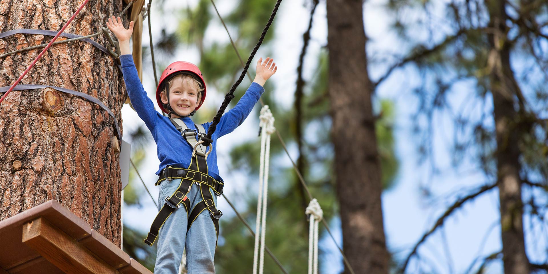 young boy on ropes course