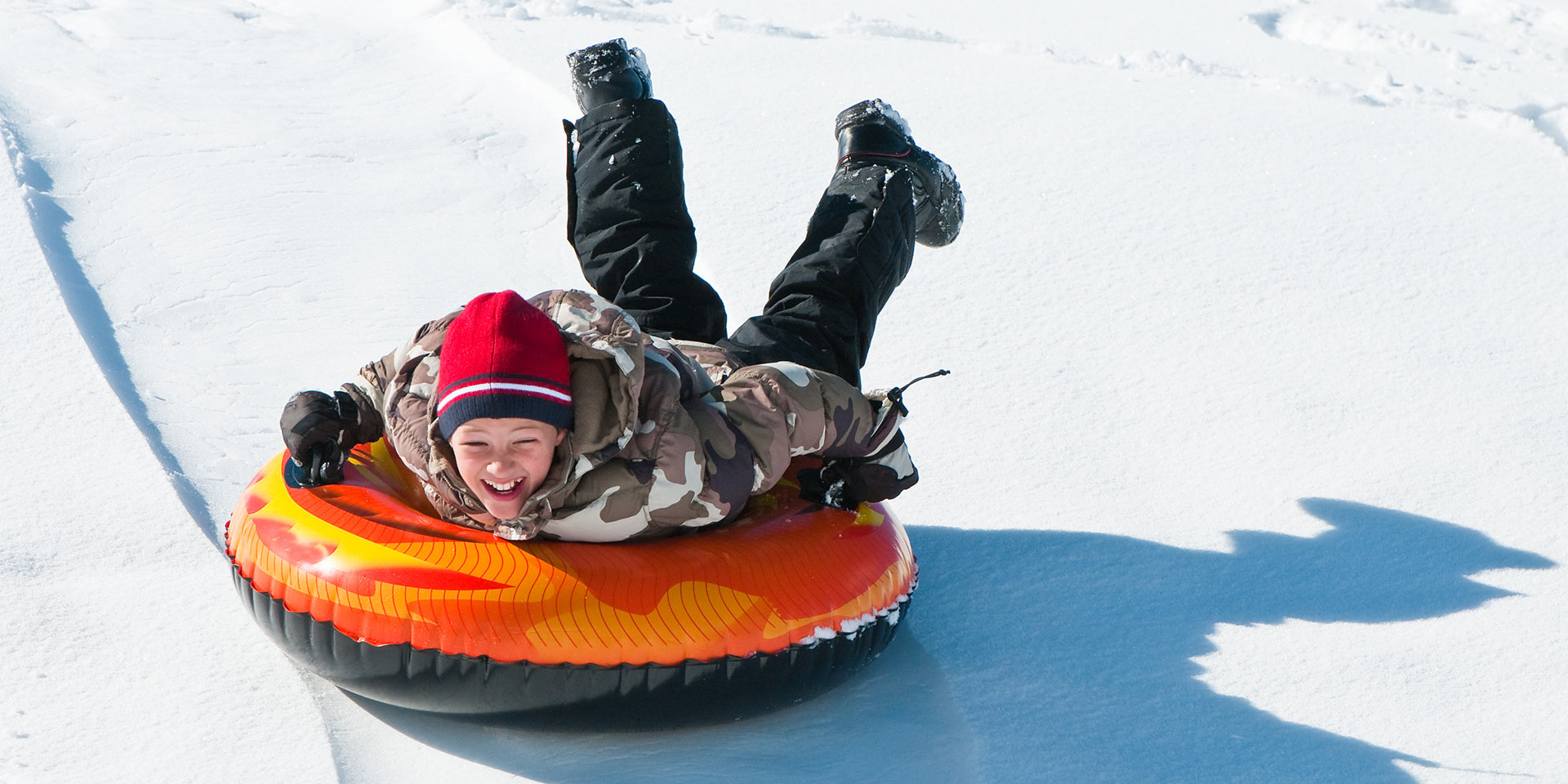 boy in snow tube