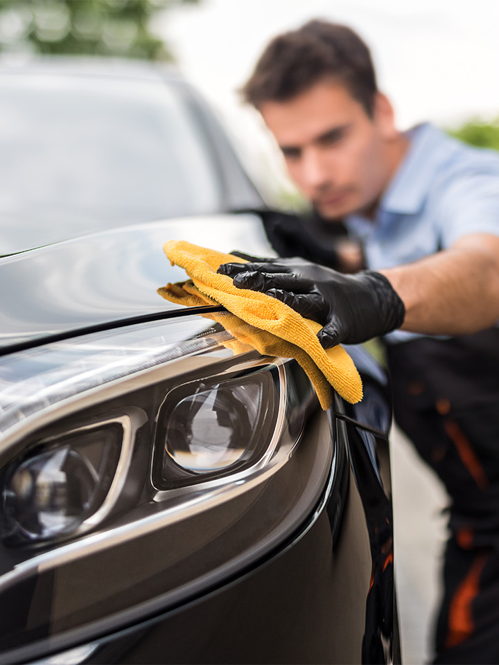 man washing car