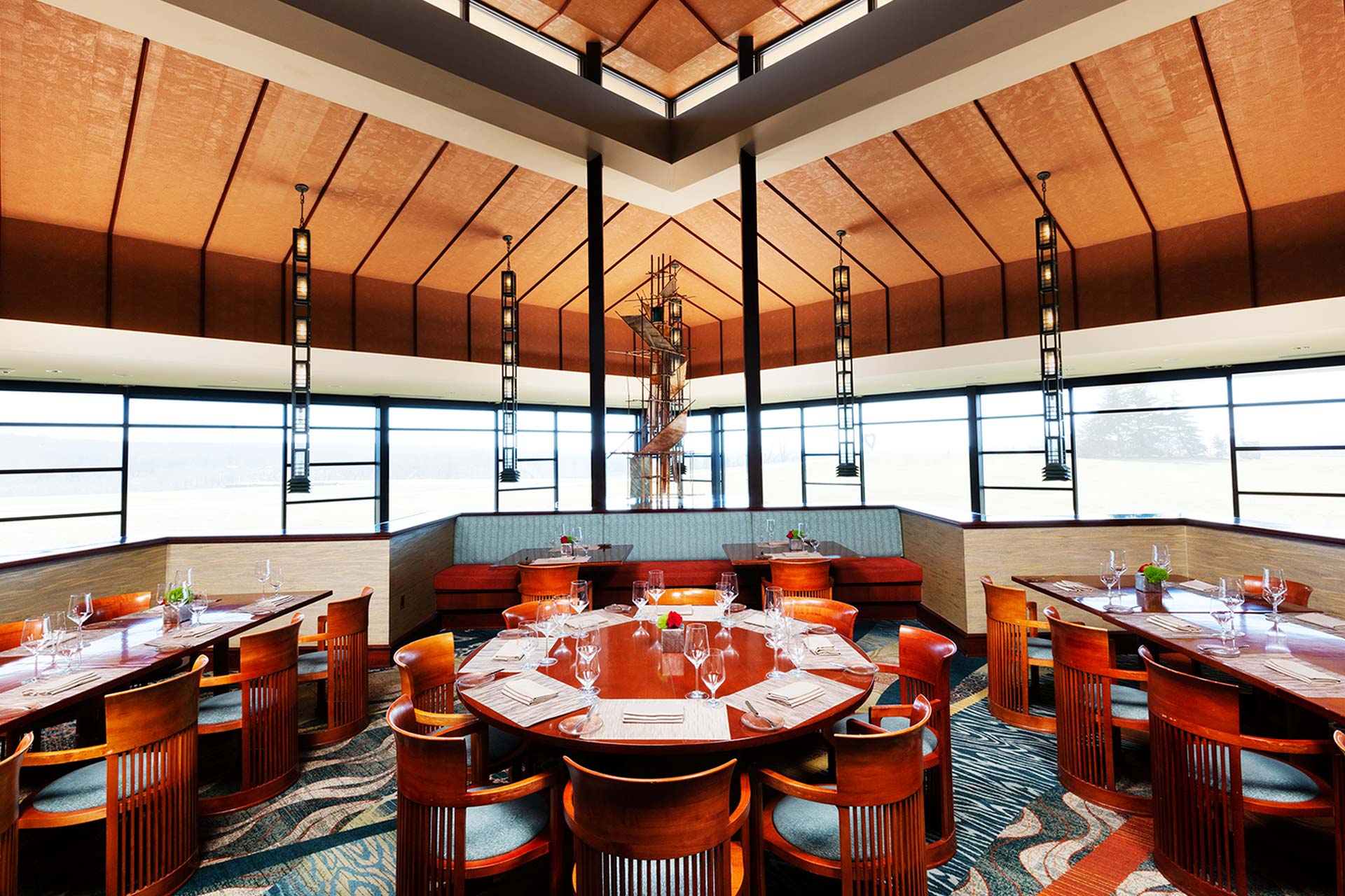 Large restaurant setting with lots of seating and large windows