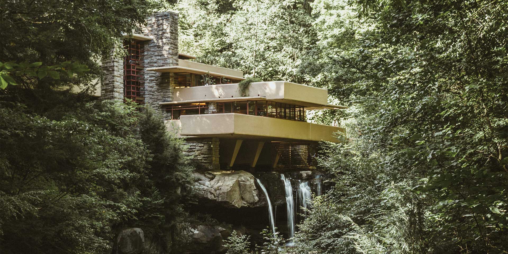 beautiful place in the woods with extended balconies and a waterfall beneath