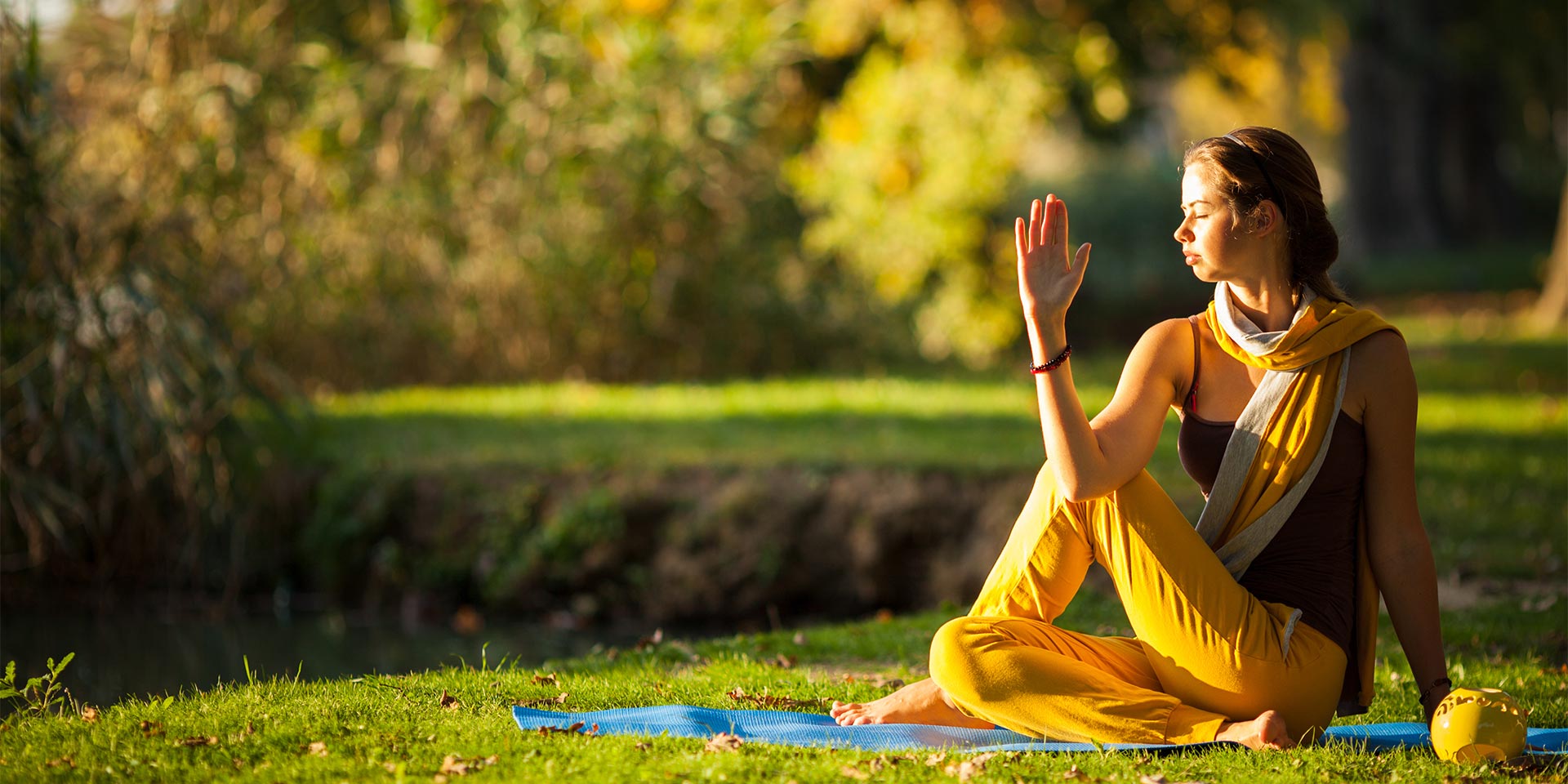 A woman doing yoga in the spring time.