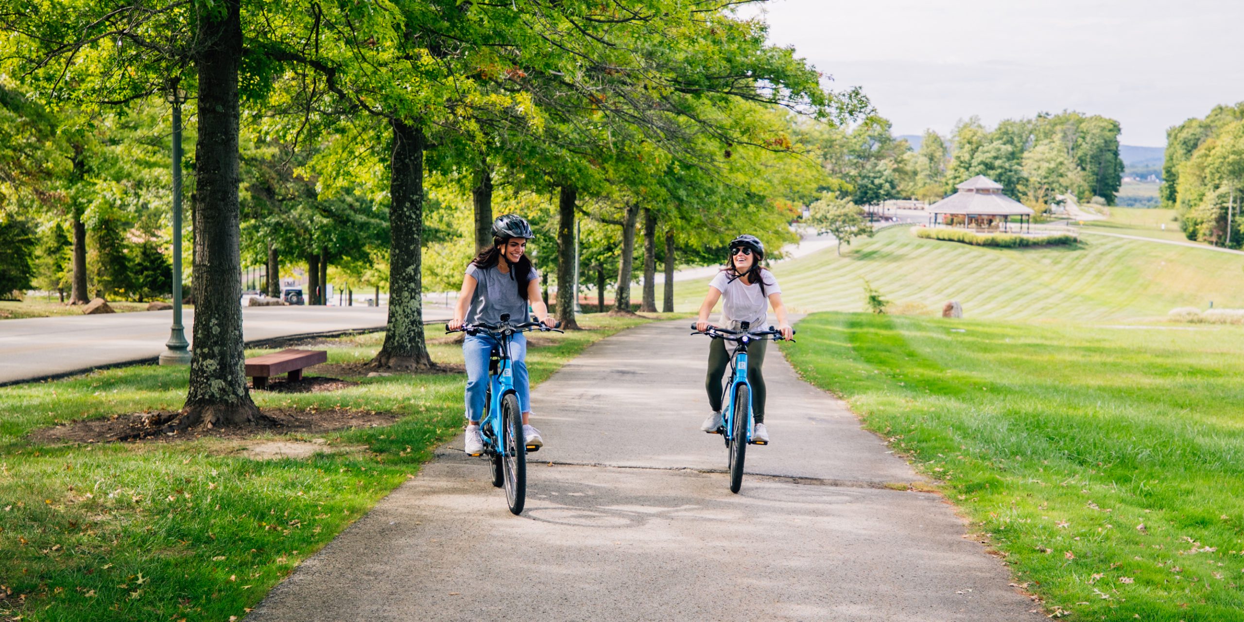 two people riding bikes