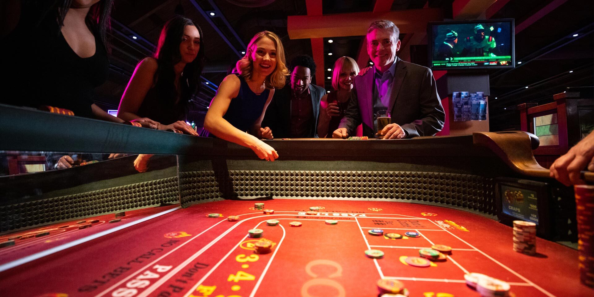 People enjoying a game at the casino.