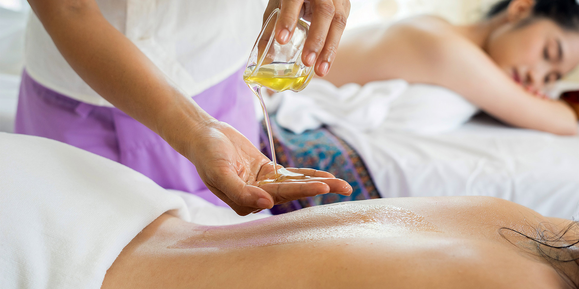 a masseuse prepping for a massage.