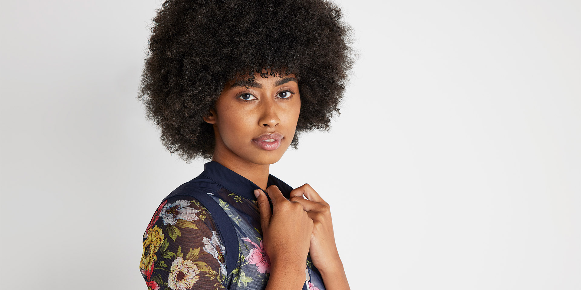 Woman wearing a floral Anatomie top