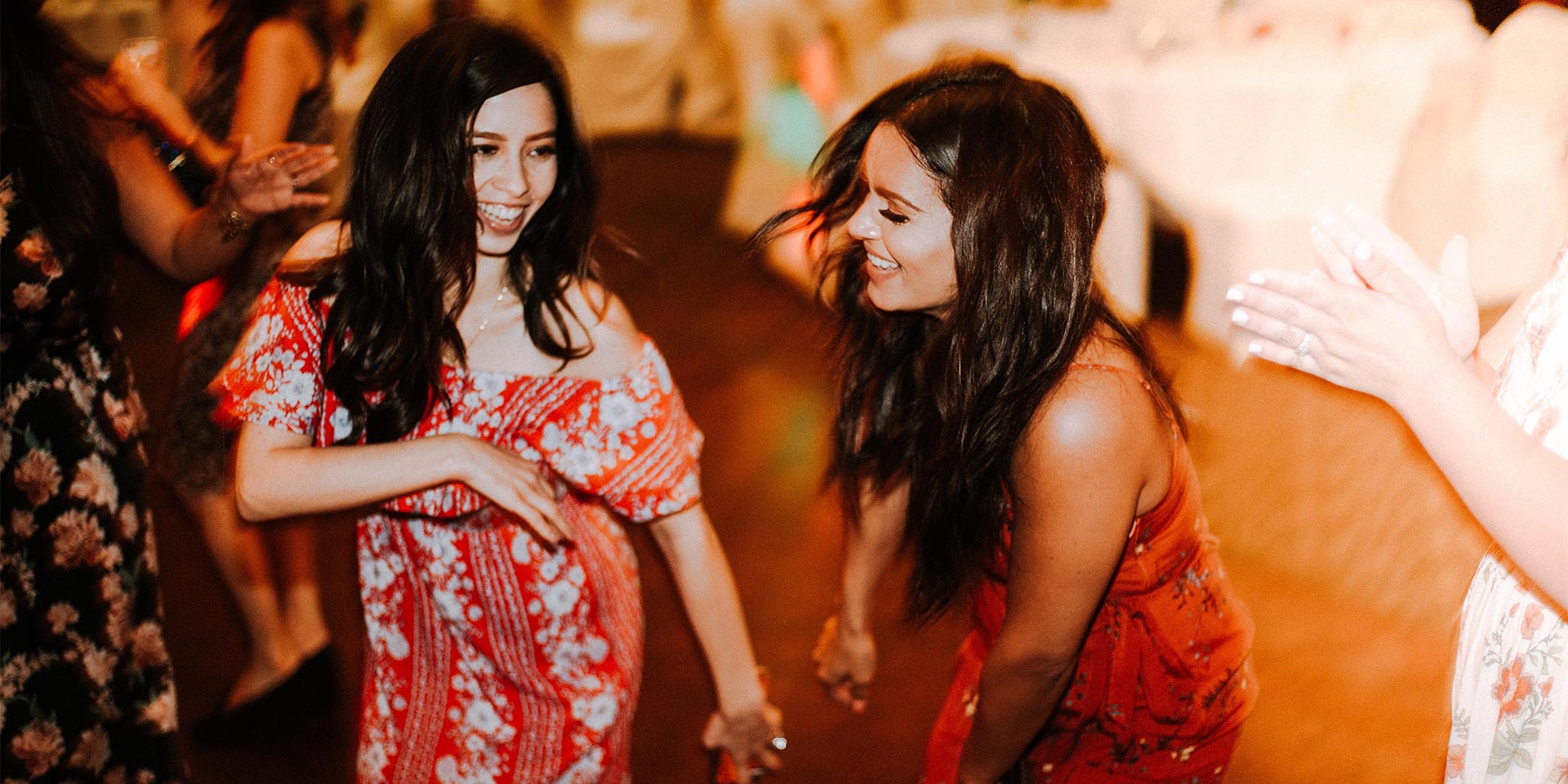 Two women in red dresses