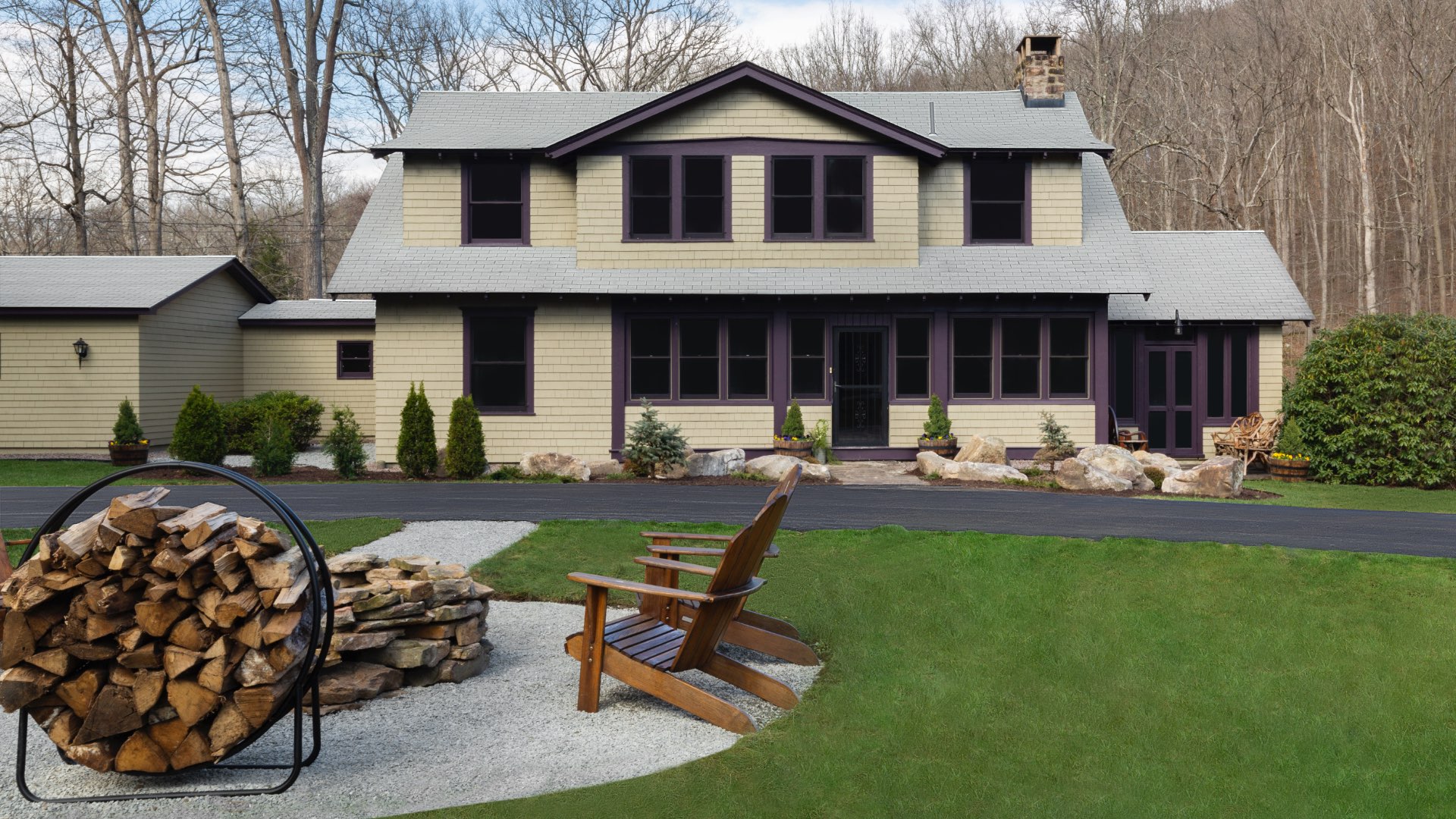 Exterior of Case Brown with fire pit and logs