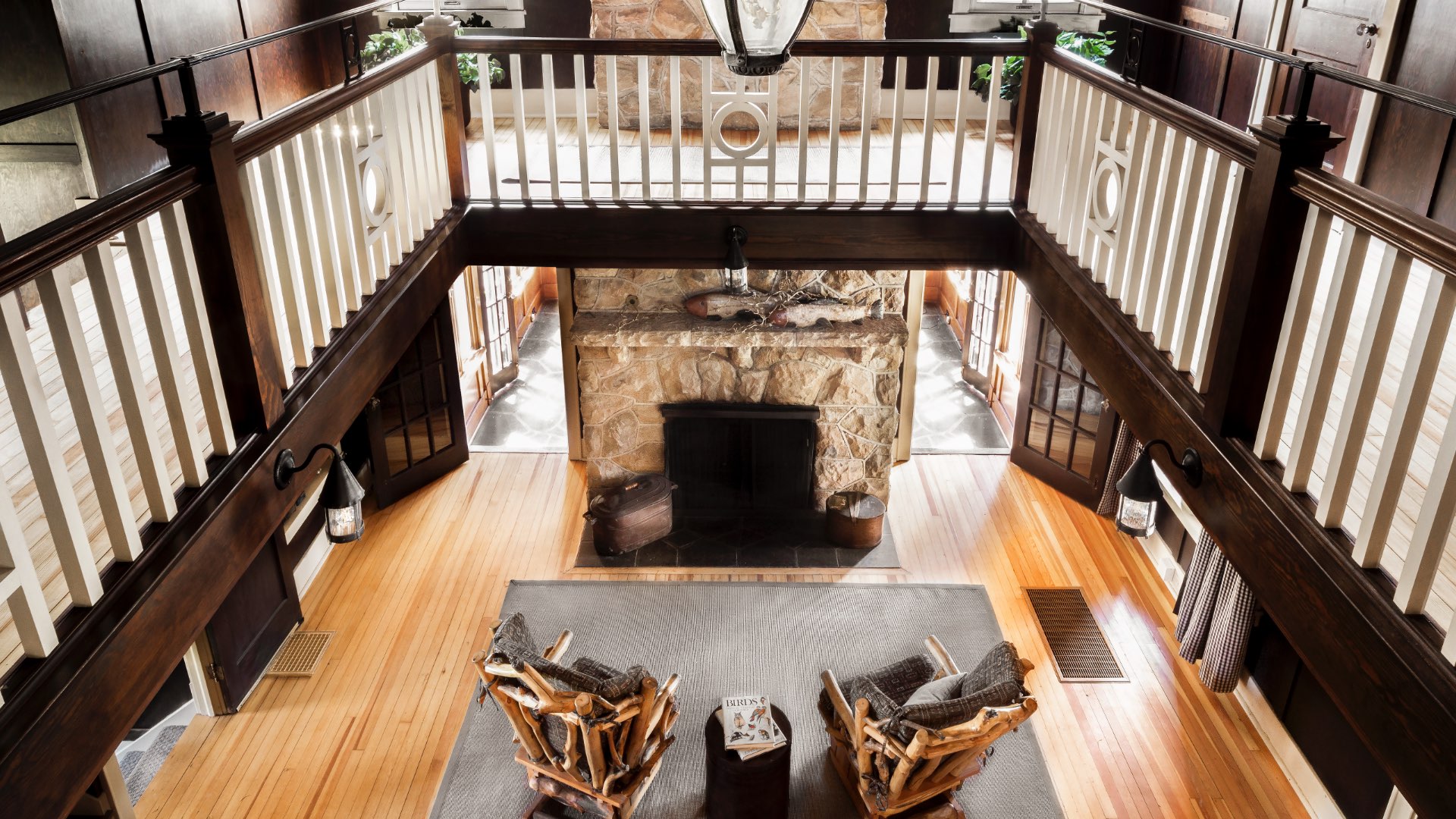 View of living room looking down with fireplace