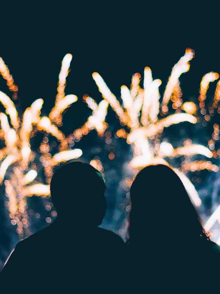 Two people watching fireworks