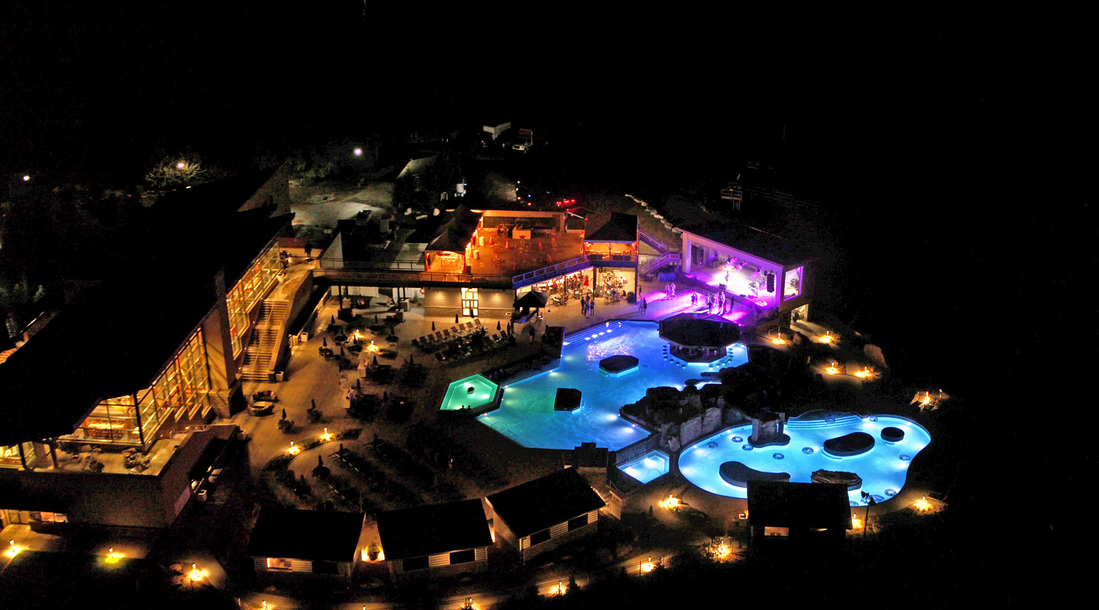 A pool complex glows at night