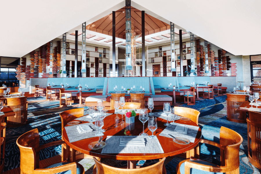 restaurant with blue booth seating and a modern open interior design
