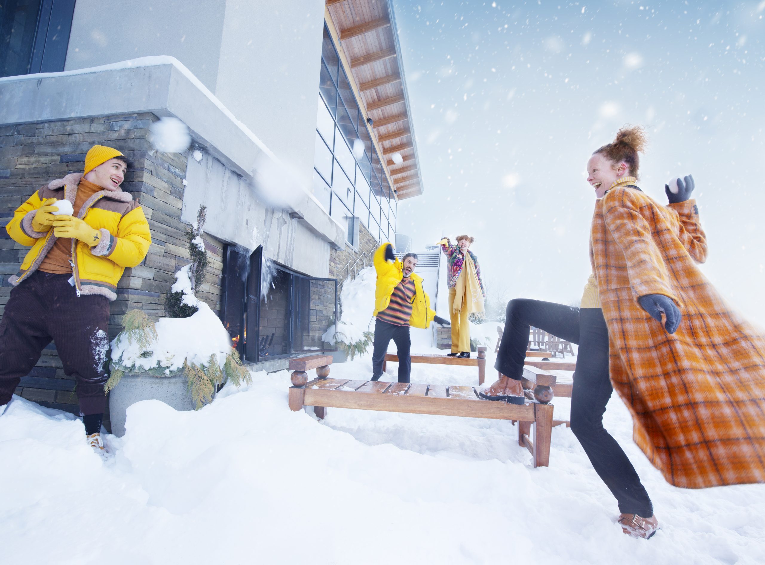 4 people having a snowball fight