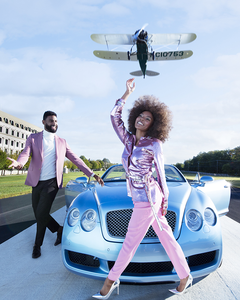 couple on a runway with a rolls royce and private jet overhead