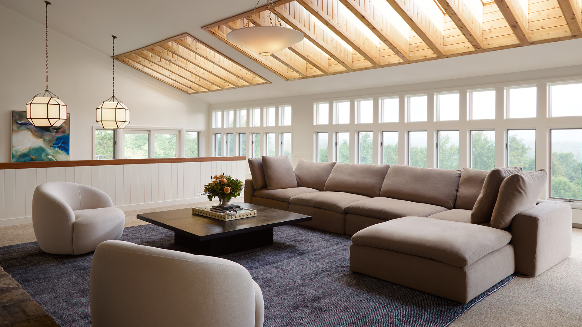 brown couch in a living room of a rental home with open windows