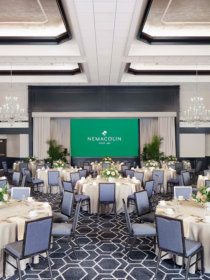 a ballroom with tables and chairs