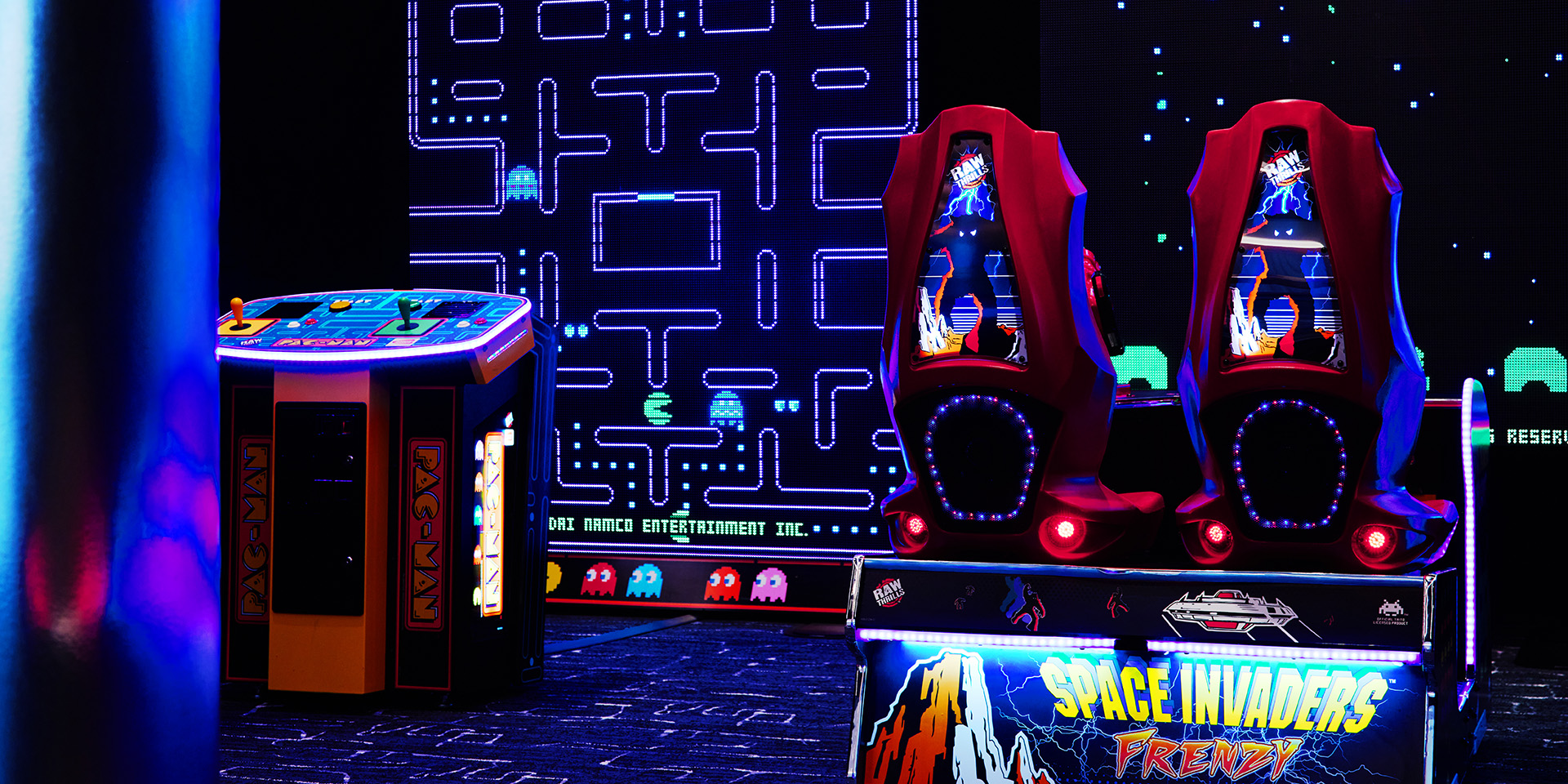 space invaders and pac man games in an arcade