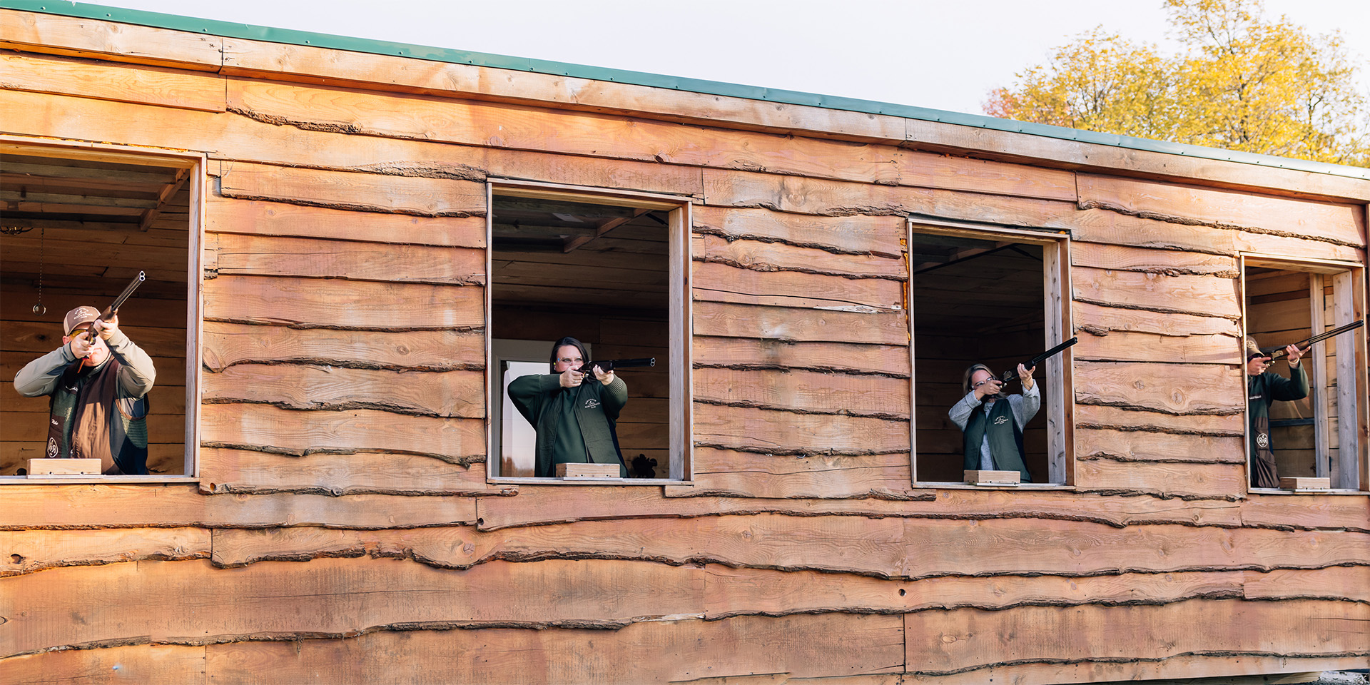 people shooting sporting clays from a heated five stand