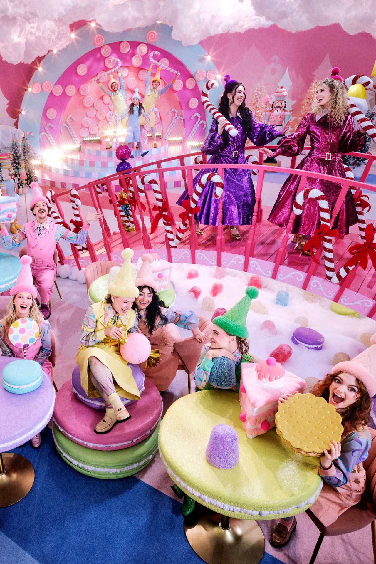 playful image of people in costume in a candy land like setting