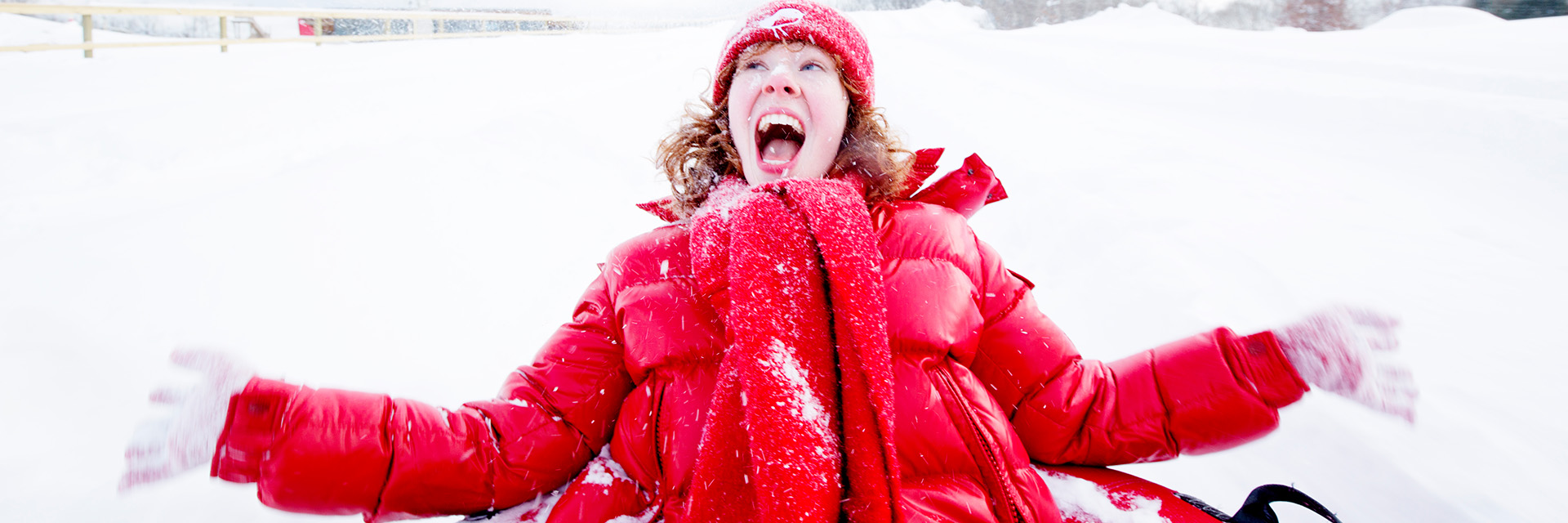 girl on a snow tube