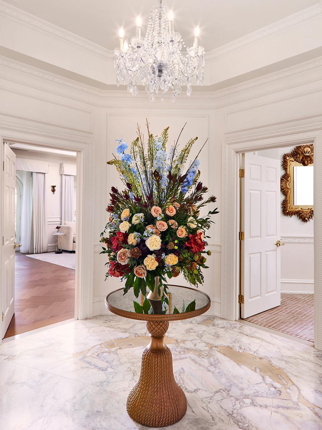 A floral bouquet on a table at the entryway to the Presidential Suite in The Chateau at Nemacolin