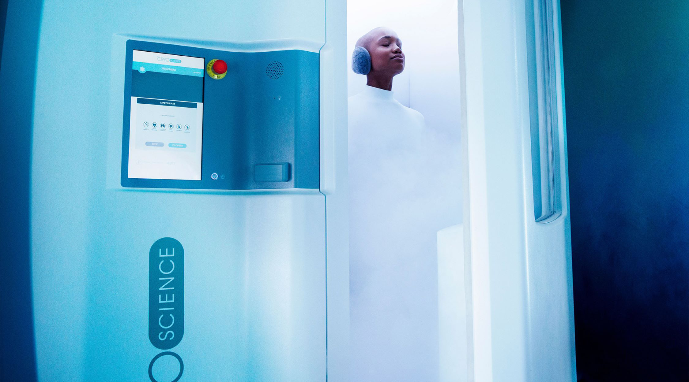 A person dressed in white with ear coverings standing in a cryotherapy chamber at the Holistic Healing Center at Nemacolin resort