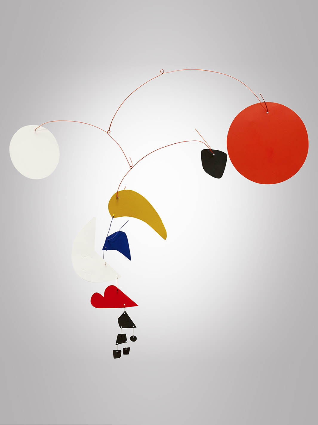 Image of Alexander Calder's mobile, with circles and various freeform shapes, as seen on display in the Nemacolin art collection