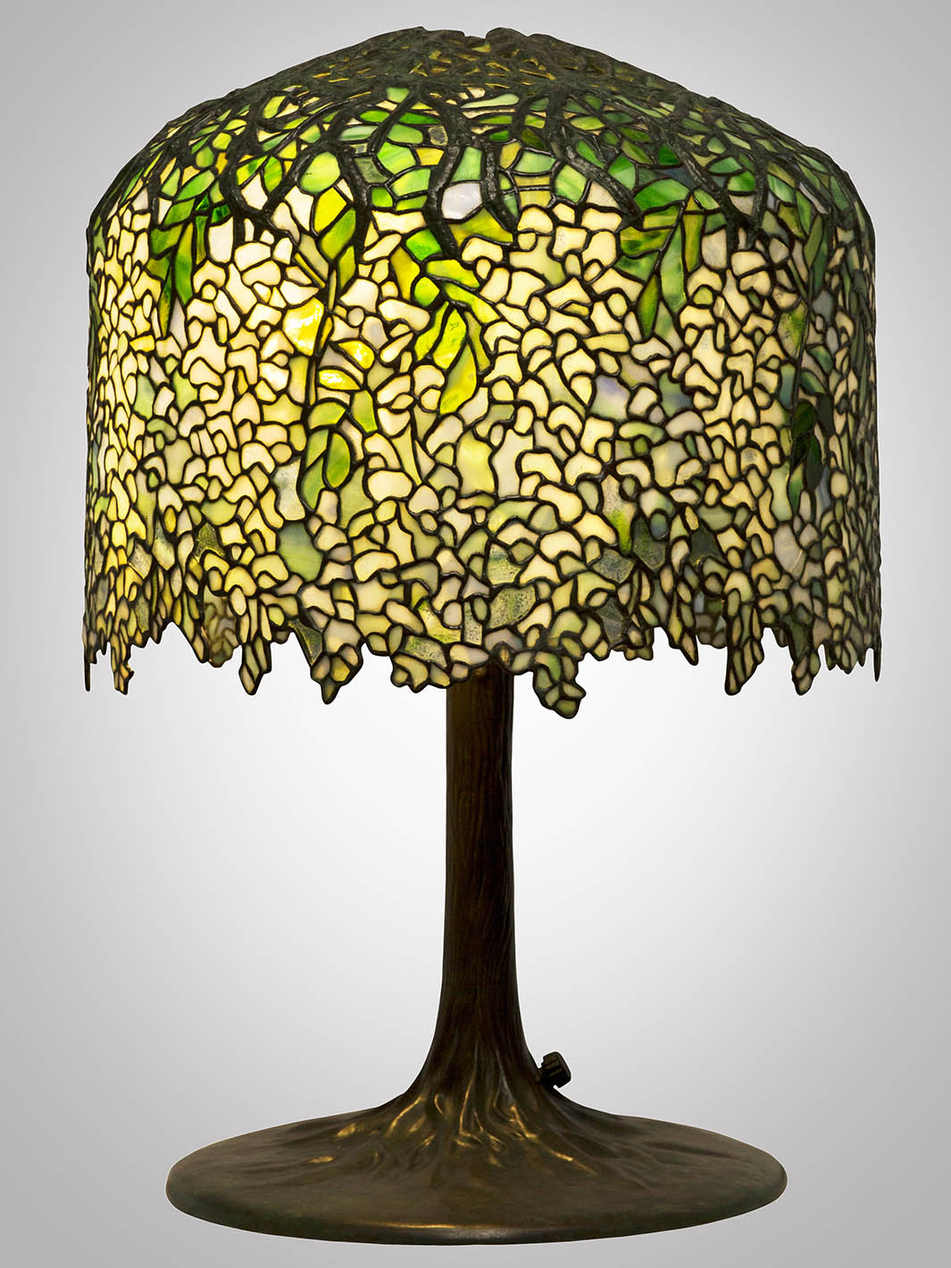 Louis Comfort Tiffany's green and yellow table lamp that resembles Wisteria tree on display in the Hardy Family Art Collection