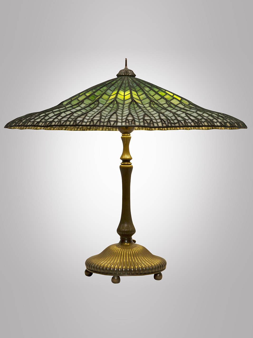 Louis Comfort Tiffany's table lamp with green accents and an angular shade titled "Mandarin Lotus" on display in the Hardy Family Art Collection