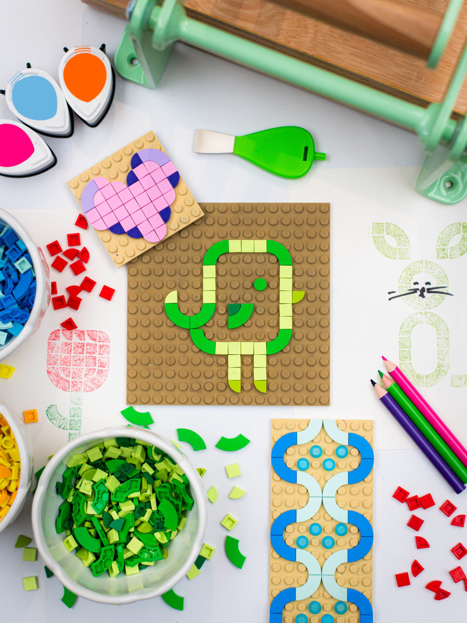 Multiple designs made out of small Lego-like bricks of various colors.