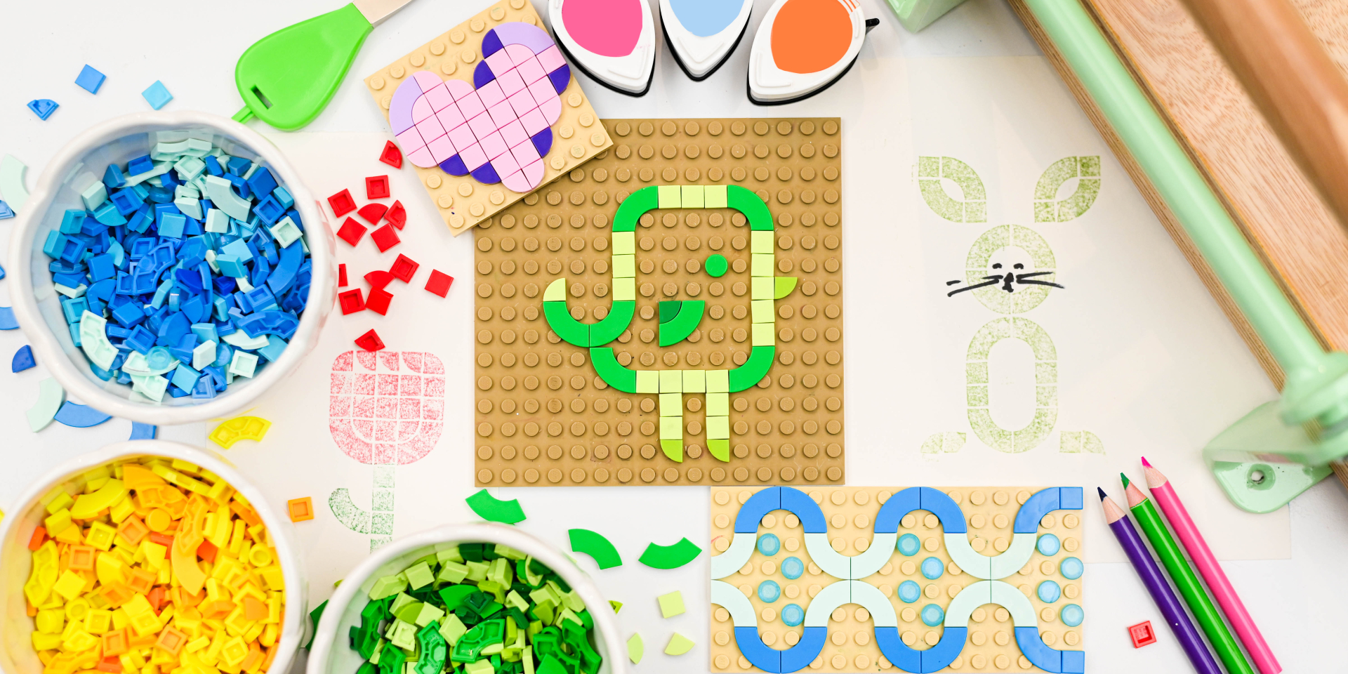 Multiple designs made out of small Lego-like bricks of various colors.